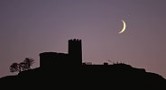 Brentor Church at dusk with crescent-moon