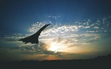 Concorde taking off, silhouetted at sunset
