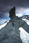 Rock pillar and mountaineers on ridge (Franco-Spanish border) approach to summit of Le Taillon (3144m), High Pyrenees, Spain