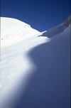 Snowy mountainside with shadow