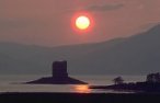 Castle Stalker with setting sun, Scotland